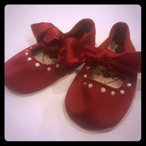 Red satin baby shoes
